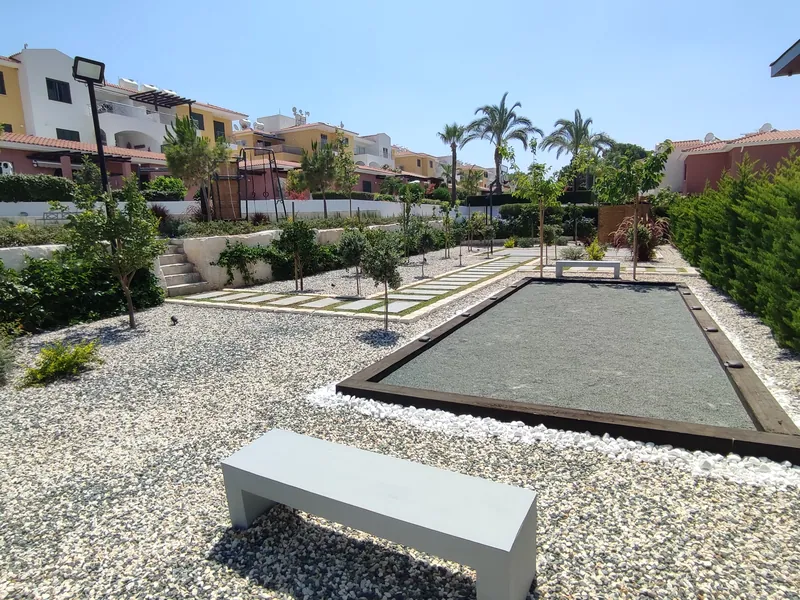 After: the pétanque court and a bench in the finished gravel garden