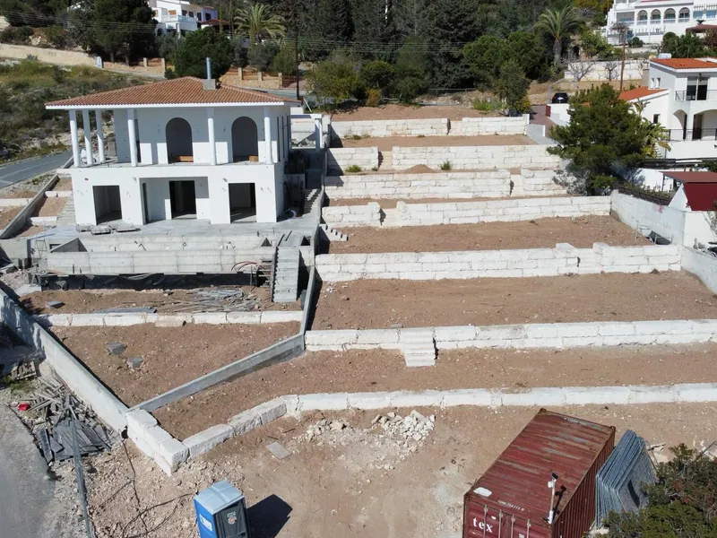 Before: the bare terraces of limestone blocks below the house, seen from above