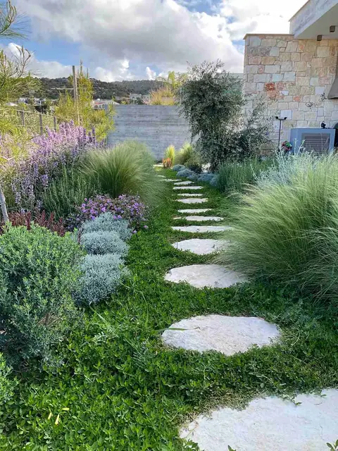 A private garden designed by Antoine Garden Designer, Paphos — paths, grasses