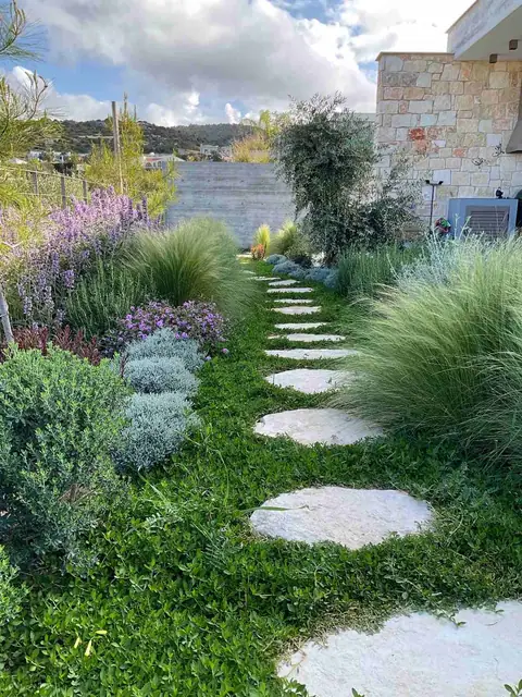 A private garden designed by Antoine Garden Designer, Paphos — paths, grasses