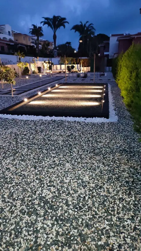 A private garden designed by Antoine Garden Designer, Paphos — pools & sea, by night