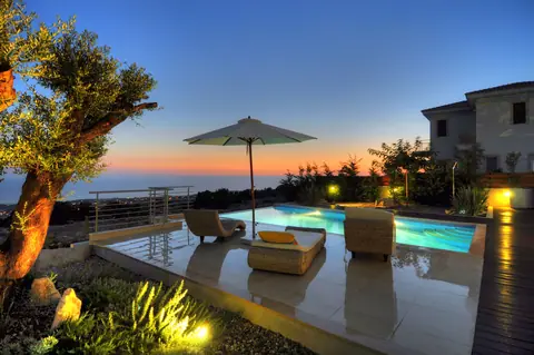 A private garden designed by Antoine Garden Designer, Paphos — olive trees, pools & sea, by night