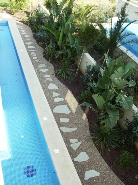 A private garden designed by Antoine Garden Designer, Paphos — paths, pools & sea