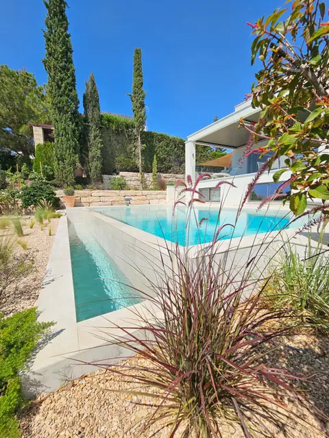 A private garden designed by Antoine Garden Designer, Paphos — grasses, pools & sea